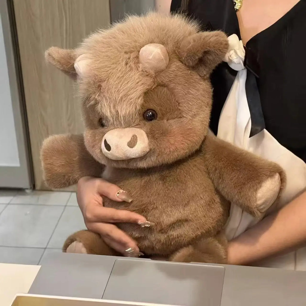 Person holding a brown teddy bear with a blurred background